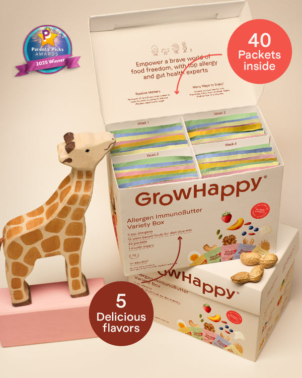 GrowHappy Allergen ImmunoButter Variety Box with a toy giraffe on a light background